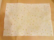 Feltro avorio con stampa brillantini "stelle" colore oro