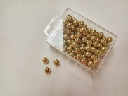 Perline in plastica colore oro lucido grande