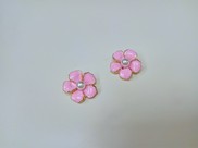 Fiore in metallo color rosa con perla centrale