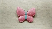 Farfalla in tessuto brillantinato colore rosa