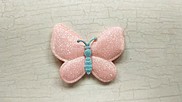 Farfalla in tessuto brillantinato colore albicocca chiaro