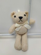 Orsetto in tessuto effetto peluche colore avorio
