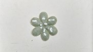 Fiore in tessuto paillette colore verde tenue