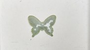 Farfalla in tessuto paillette colore verde tenue