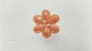 Fiore in tessuto paillette colore arancione